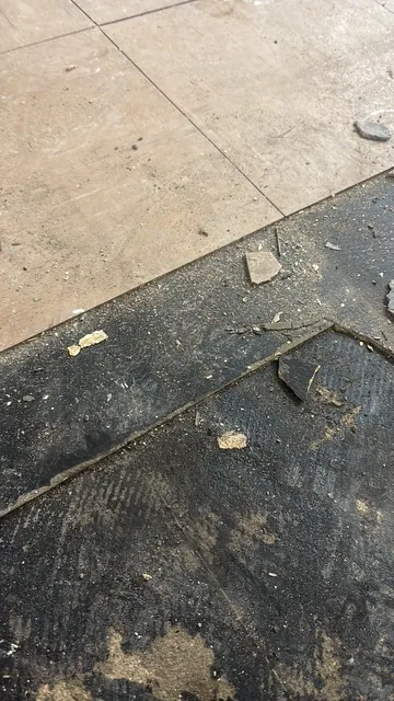 Black bitumen mastic floor removal in a SE8 flat